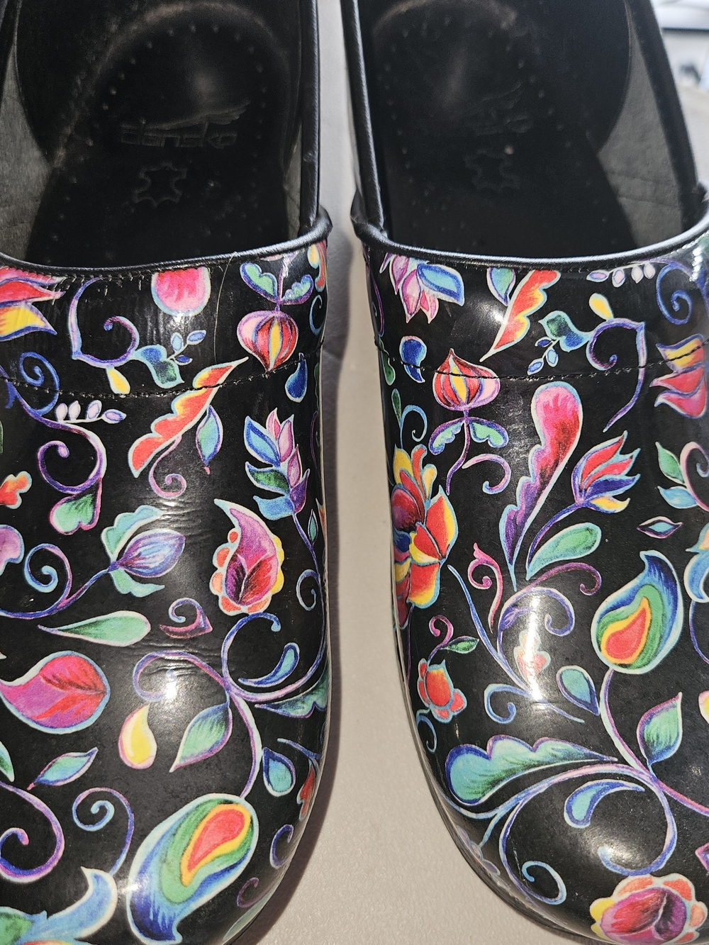 Dansko Women’s Black Floral Clogs